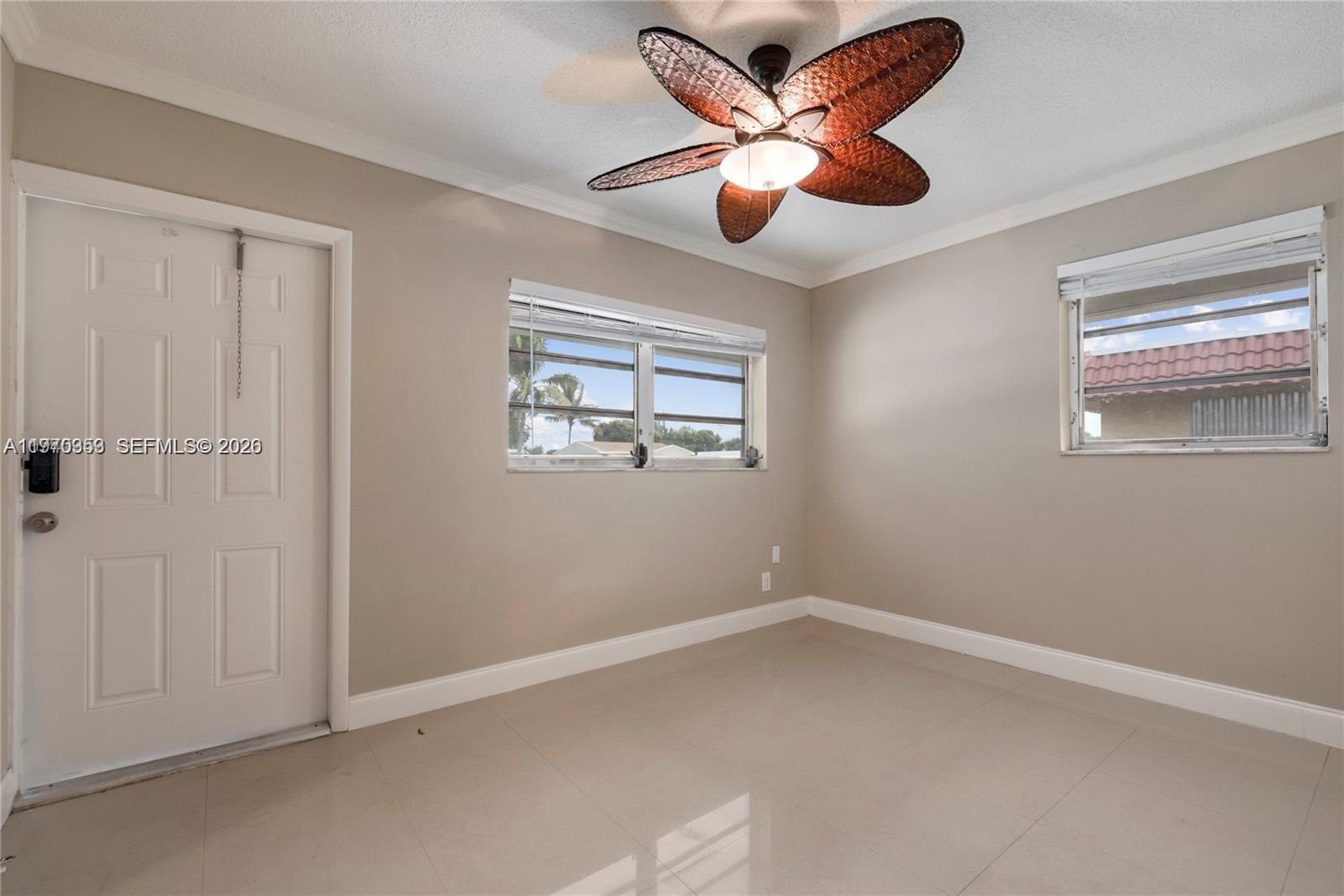 5632 Hayes Street Hollywood, FL 33021 - Photo 18 of 42 an empty room with a window and a fan