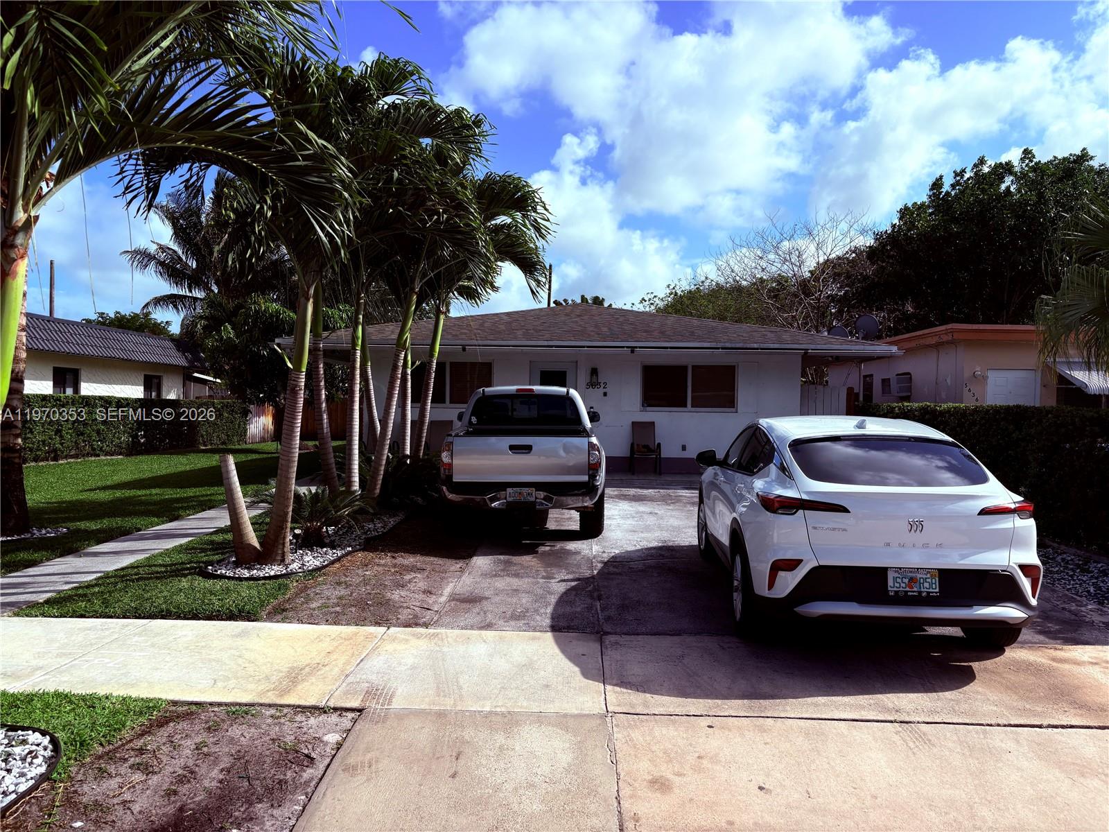 5632 Hayes Street Hollywood, FL 33021 - Photo 21 of 42 a front view of a house with a garden