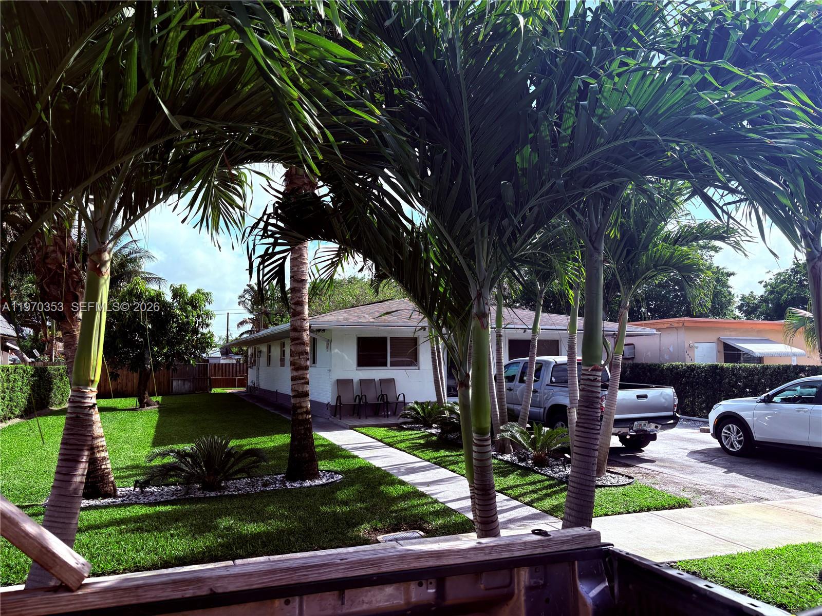 5632 Hayes Street Hollywood, FL 33021 - Photo 23 of 42 a front view of a house with garden