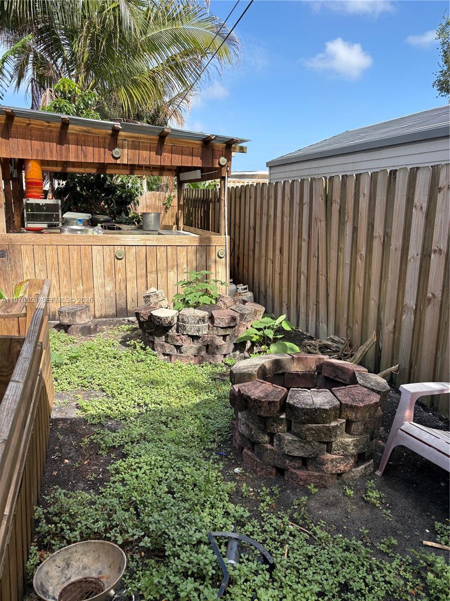 5632 Hayes Street Hollywood, FL 33021 - Photo 31 of 42 a garden view with a seating space