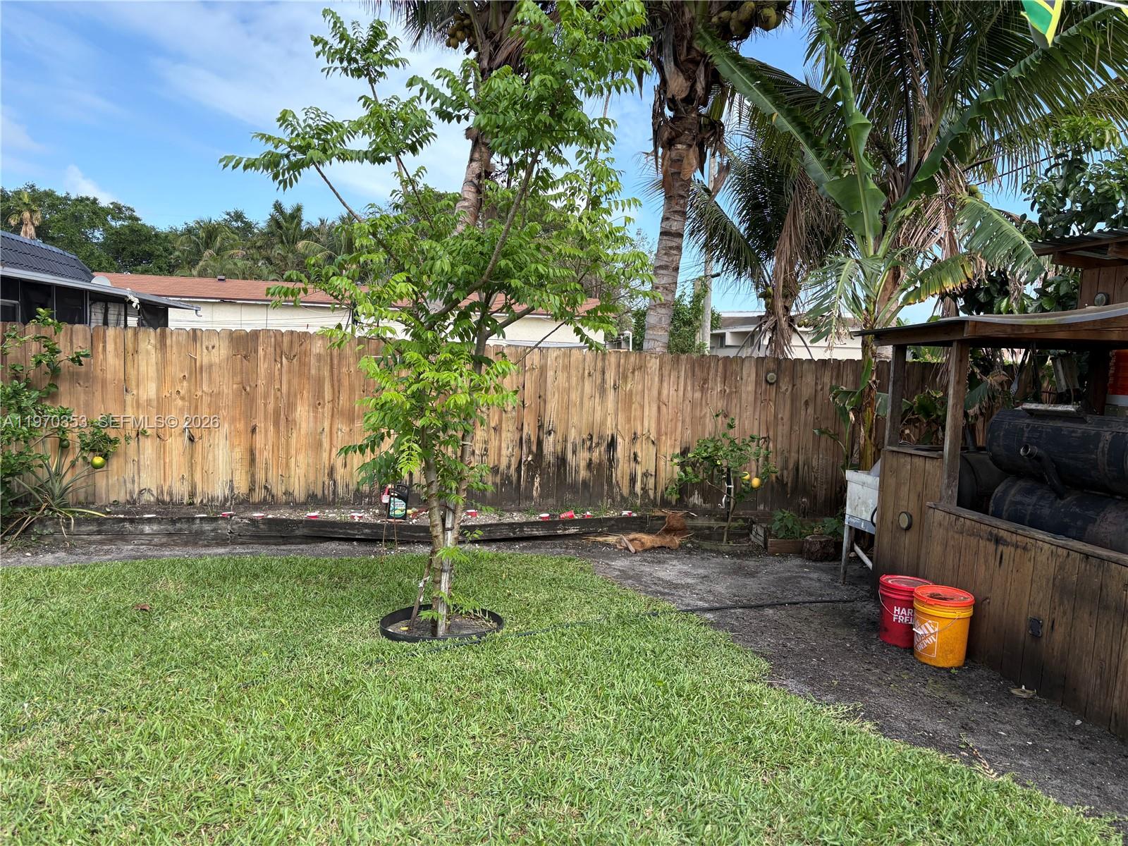 5632 Hayes Street Hollywood, FL 33021 - Photo 35 of 42 a backyard of a house with barbeque oven