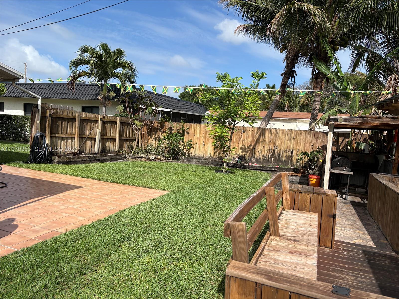 5632 Hayes Street Hollywood, FL 33021 - Photo 39 of 42 a front view of a house with a yard