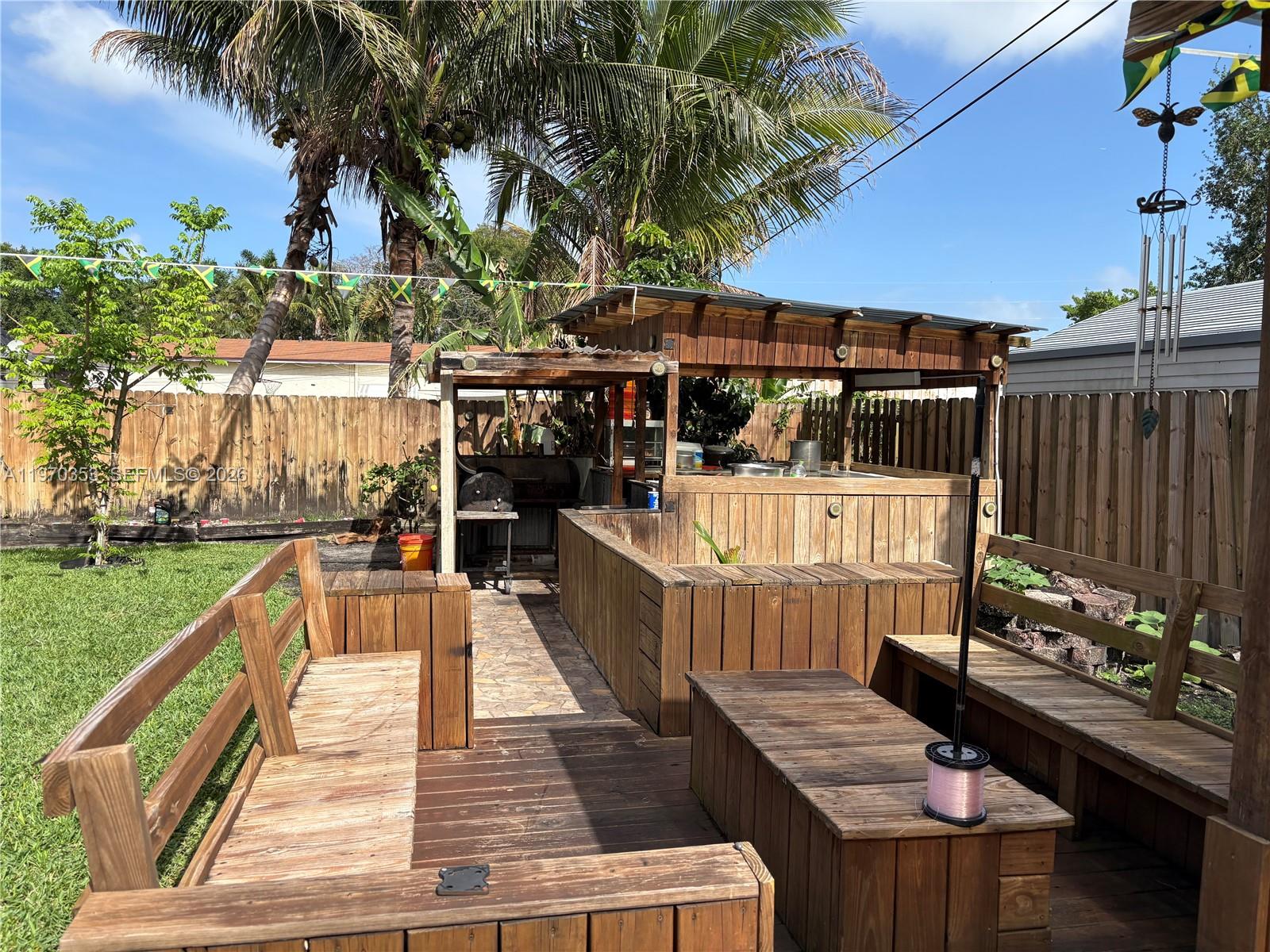 5632 Hayes Street Hollywood, FL 33021 - Photo 40 of 42 a view of a balcony with two chairs and a table