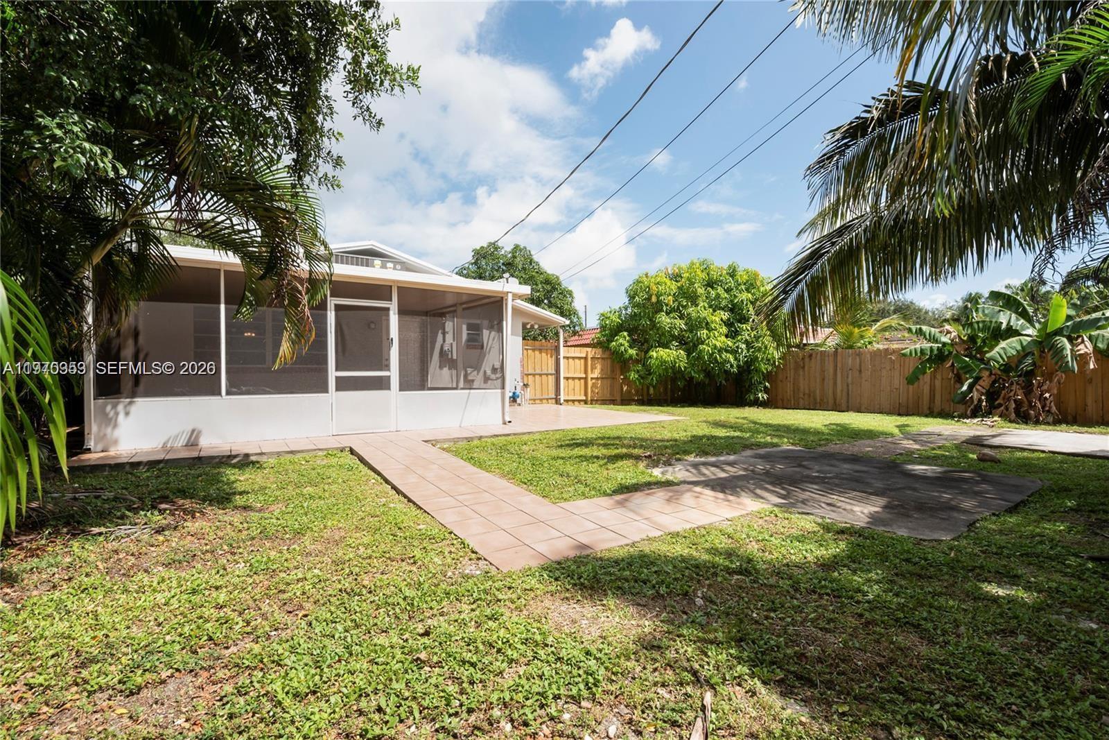 5632 Hayes Street Hollywood, FL 33021 - Photo 4 of 42 a view of a house with a yard