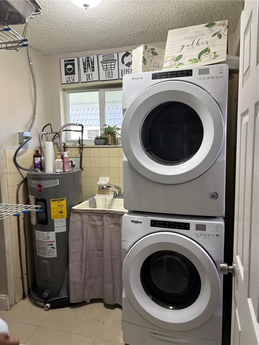 5632 Hayes Street Hollywood, FL 33021 - Photo 42 of 42 a utility room with dryer and washer
