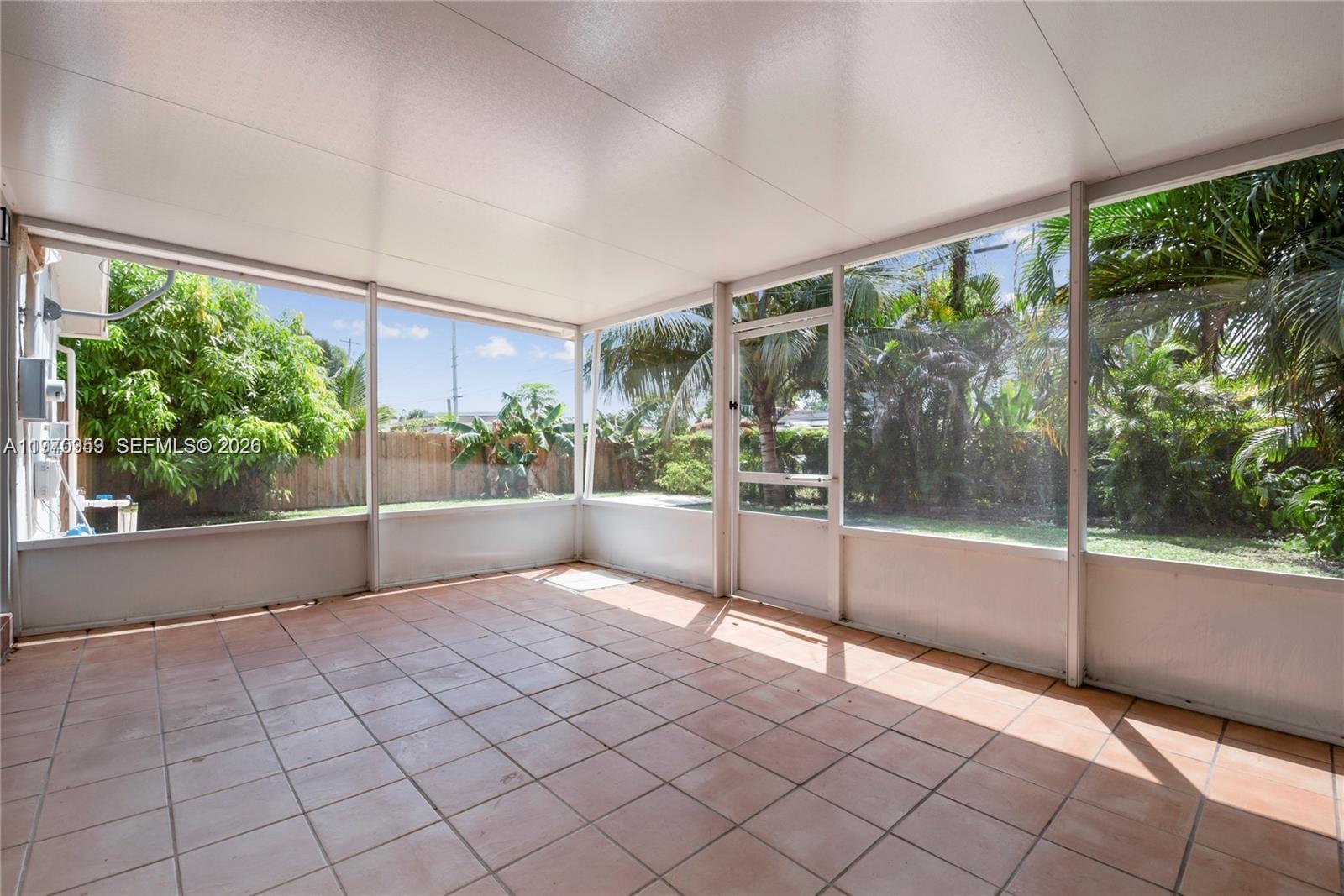 5632 Hayes Street Hollywood, FL 33021 - Photo 5 of 42 a view of an empty room with windows