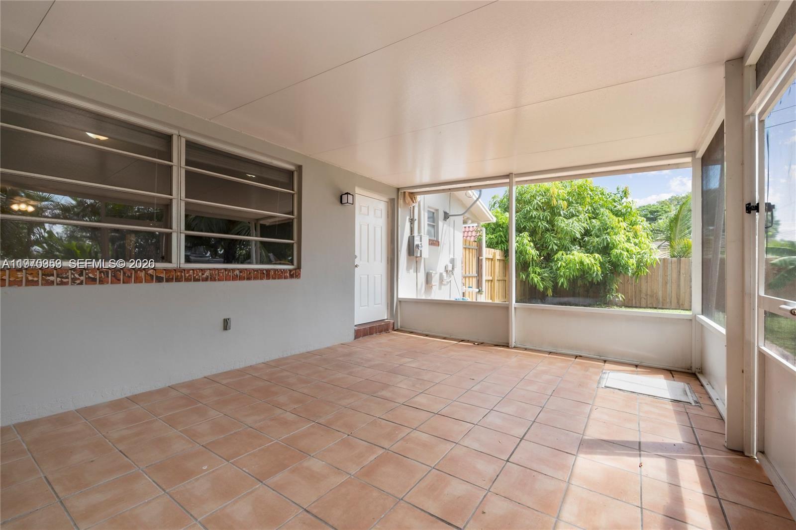 5632 Hayes Street Hollywood, FL 33021 - Photo 7 of 42 a view of an empty room with a window