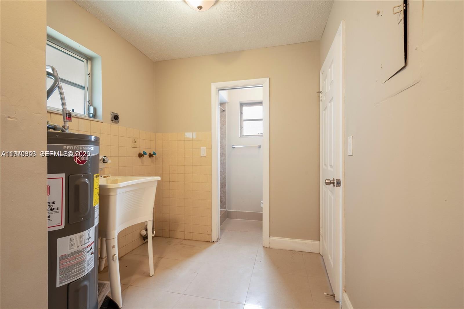 5632 Hayes Street Hollywood, FL 33021 - Photo 10 of 42 a view of a room with table and chair