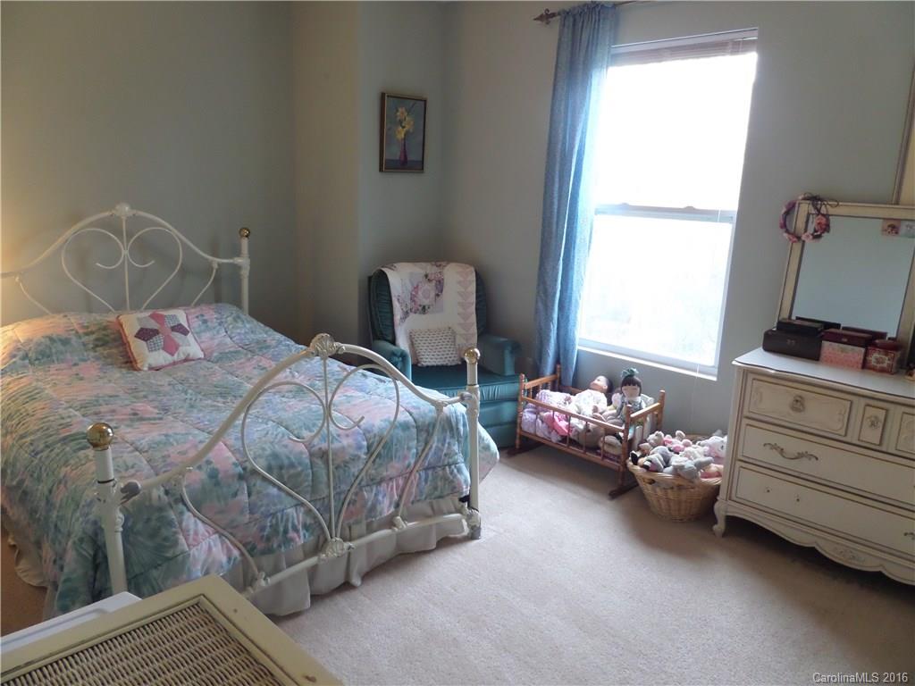 2030 Durand Road, Unit 7 Fort Mill, SC 29715 - Photo 16 of 21 a bedroom with a bed and a window