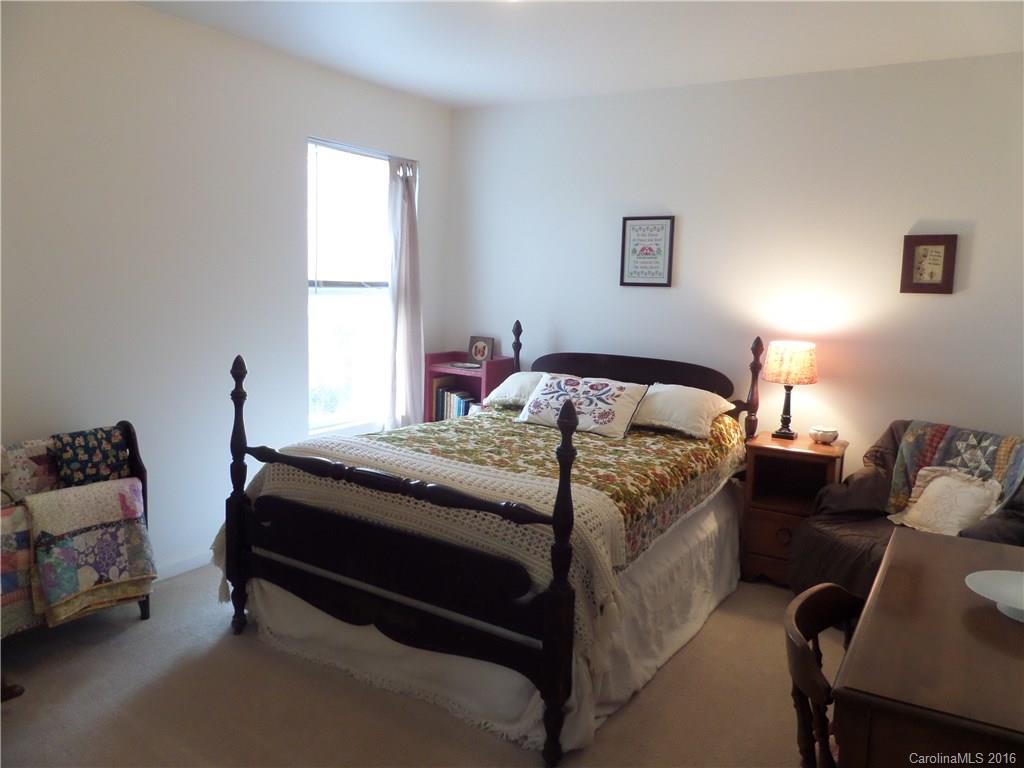 2030 Durand Road, Unit 7 Fort Mill, SC 29715 - Photo 17 of 21 a bedroom with a bed and a couch