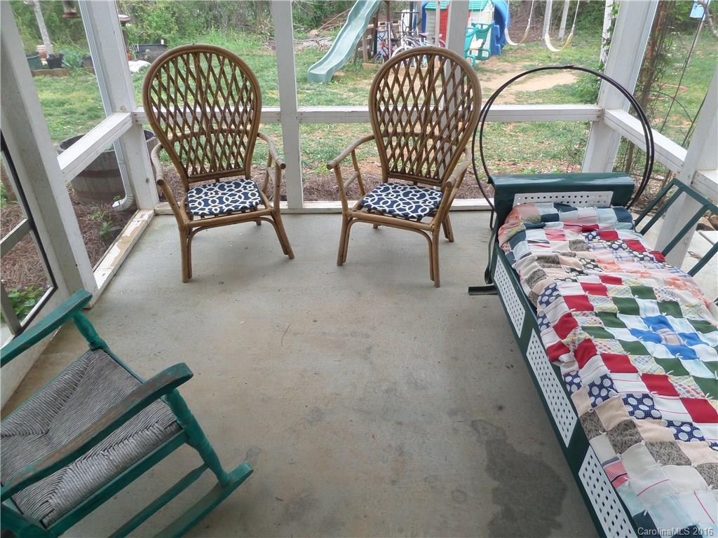 2030 Durand Road, Unit 7 Fort Mill, SC 29715 - Photo 19 of 21 a balcony with wooden floor outdoor seating and furniture