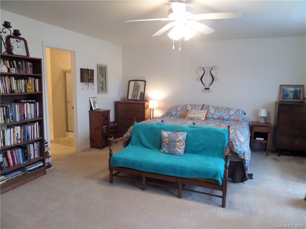 2030 Durand Road, Unit 7 Fort Mill, SC 29715 - Photo 10 of 21 a bedroom with bed and a book shelf