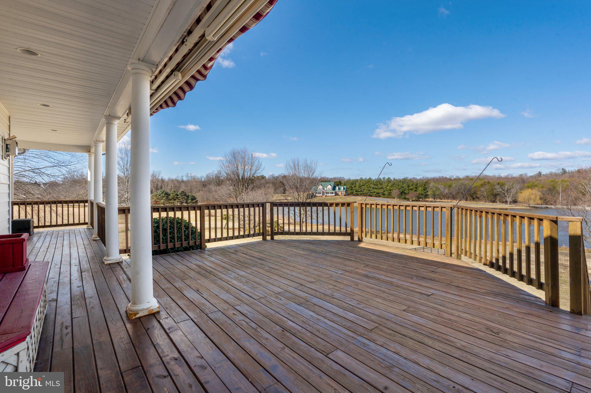 18464 Snaffle Lane Culpeper, VA 22701 - Photo 12 of 64 a view of wooden deck with a lake view