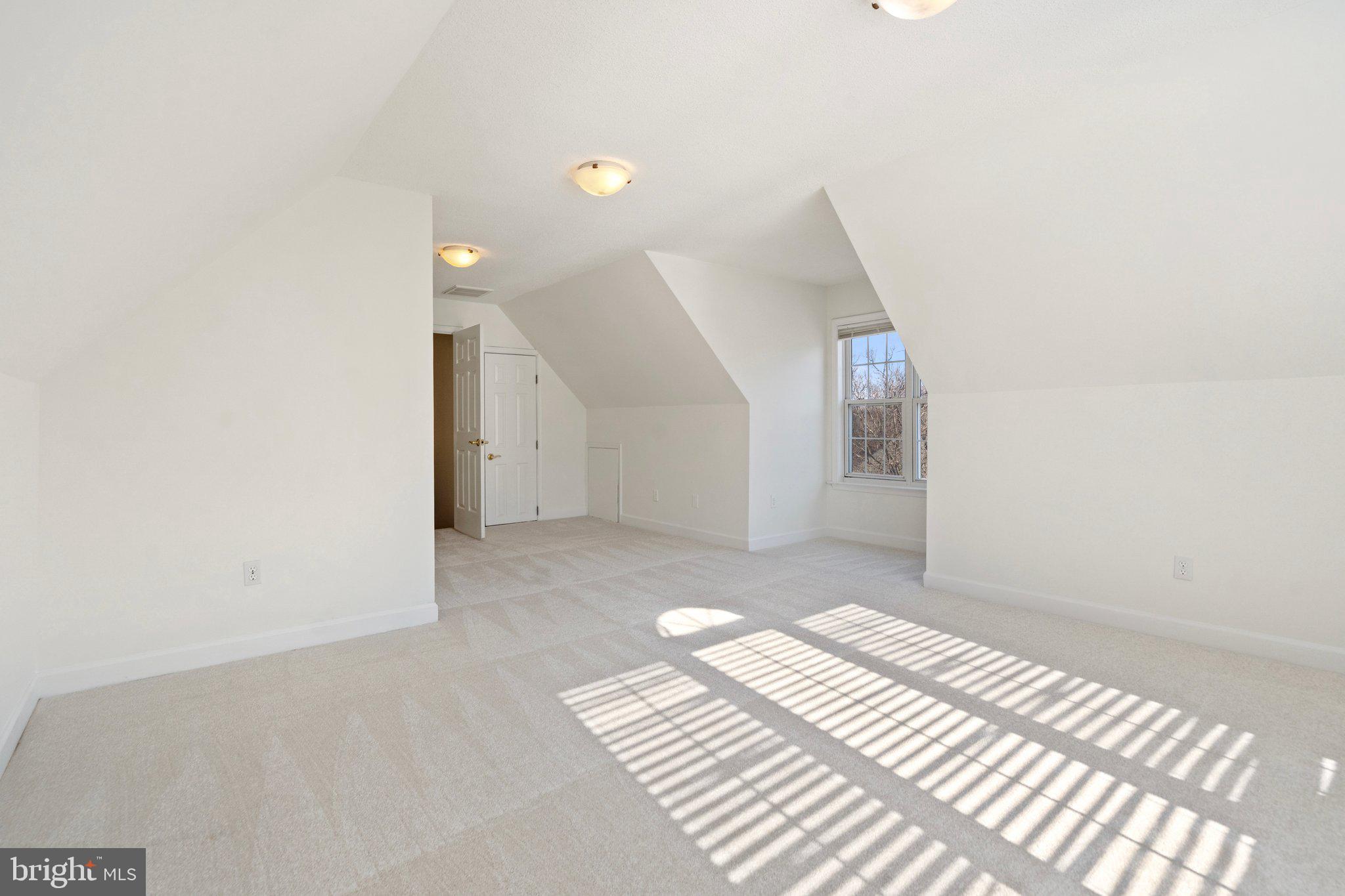 18464 Snaffle Lane Culpeper, VA 22701 - Photo 46 of 64 a view of a big room with wooden floor and windows