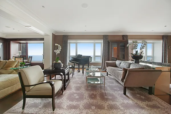 a living room with furniture rug and window