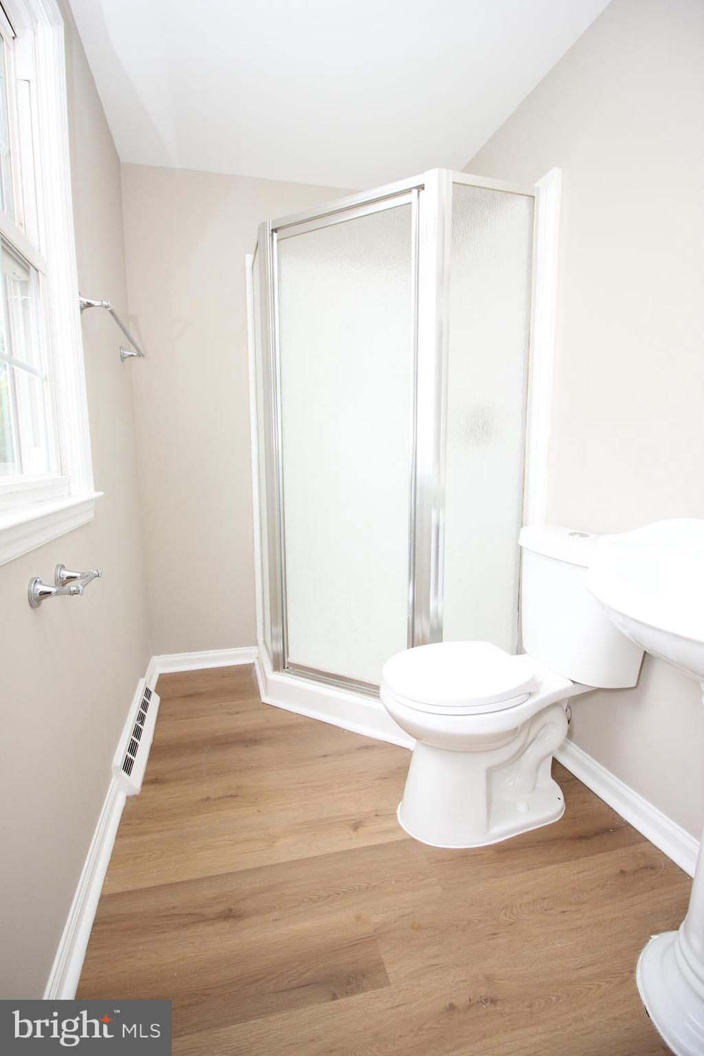 27 West Kennedy Drive Clementon, NJ 08021 - Photo 34 of 39 a white toilet sitting next to a bathroom sink
