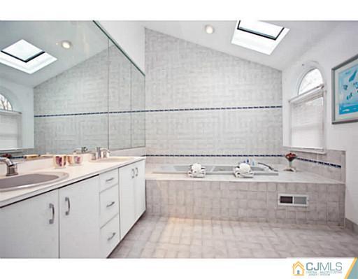 6 Valarie Road Edison, NJ 08820 - Photo 12 of 23 a view of a kitchen with cabinets