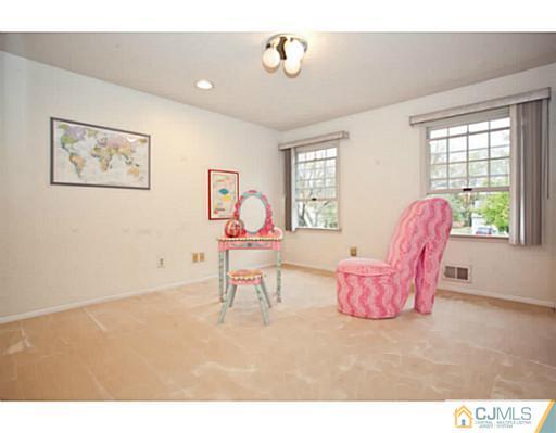6 Valarie Road Edison, NJ 08820 - Photo 16 of 23 a living room with furniture and a window