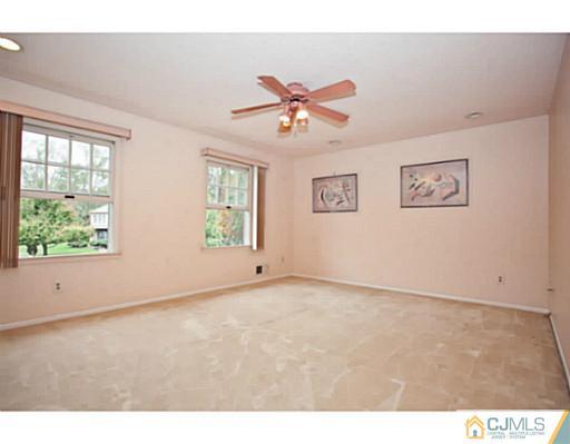 6 Valarie Road Edison, NJ 08820 - Photo 17 of 23 a view of an empty room with a window