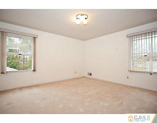 6 Valarie Road Edison, NJ 08820 - Photo 18 of 23 a view of an empty room with a window