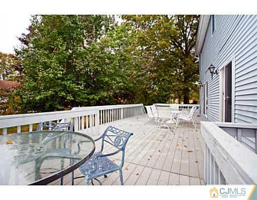 6 Valarie Road Edison, NJ 08820 - Photo 20 of 23 a view of balcony with wooden floor and seating space