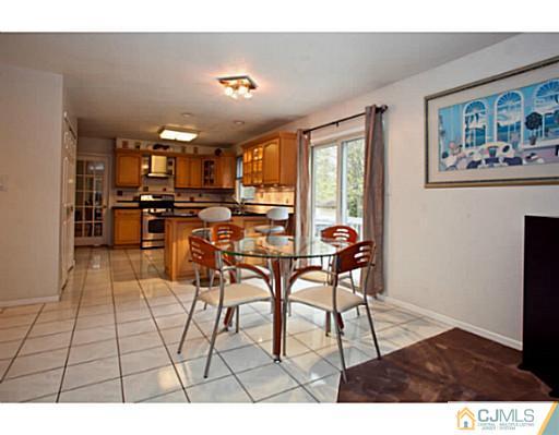 6 Valarie Road Edison, NJ 08820 - Photo 5 of 23 a view of a dining room with furniture window and outside view