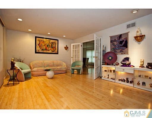 6 Valarie Road Edison, NJ 08820 - Photo 6 of 23 a living room with furniture and a flat screen tv