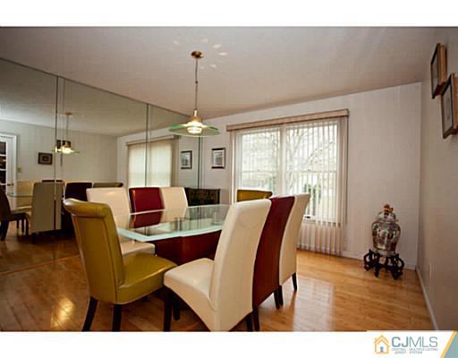 6 Valarie Road Edison, NJ 08820 - Photo 7 of 23 a view of a dining room with furniture window and wooden floor