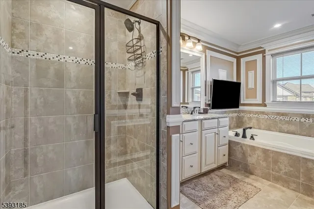 a bathroom with a bathtub sink and mirror