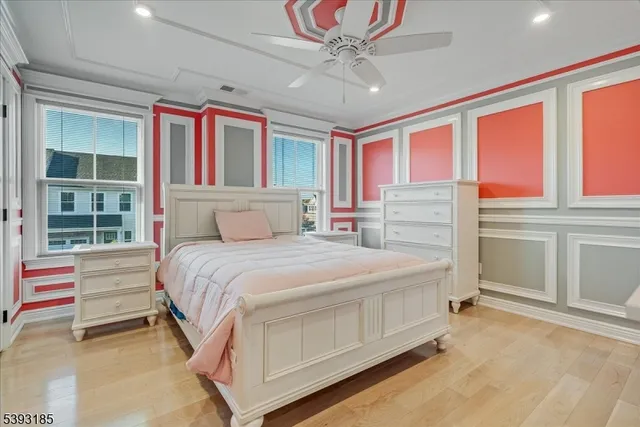 a bedroom with a bed dresser and a window