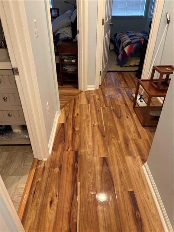 100 Denniston Street, Unit 59 Pittsburgh, PA 15206 - Photo 15 of 24 a view of a hallway with wooden floor and staircase