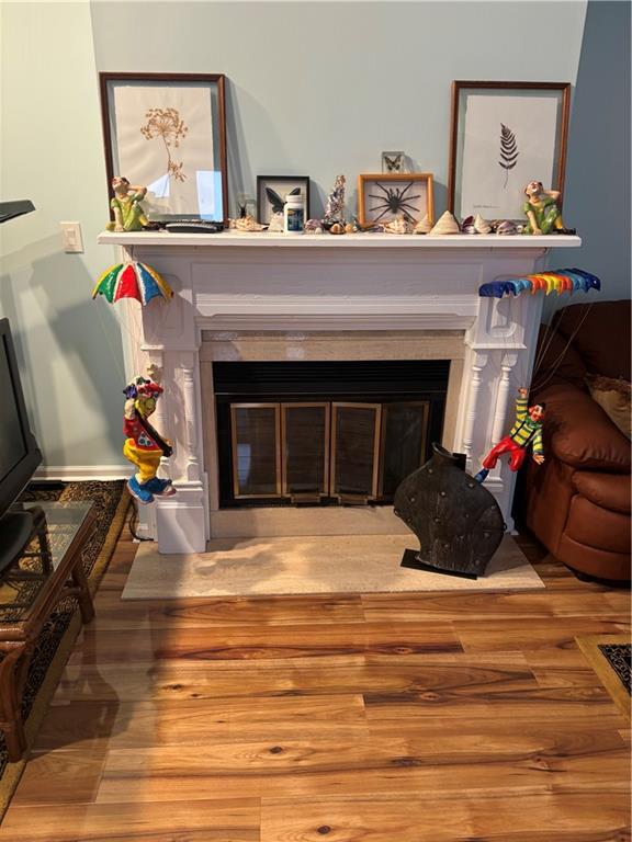 100 Denniston Street, Unit 59 Pittsburgh, PA 15206 - Photo 23 of 24 a living room with furniture and a fireplace