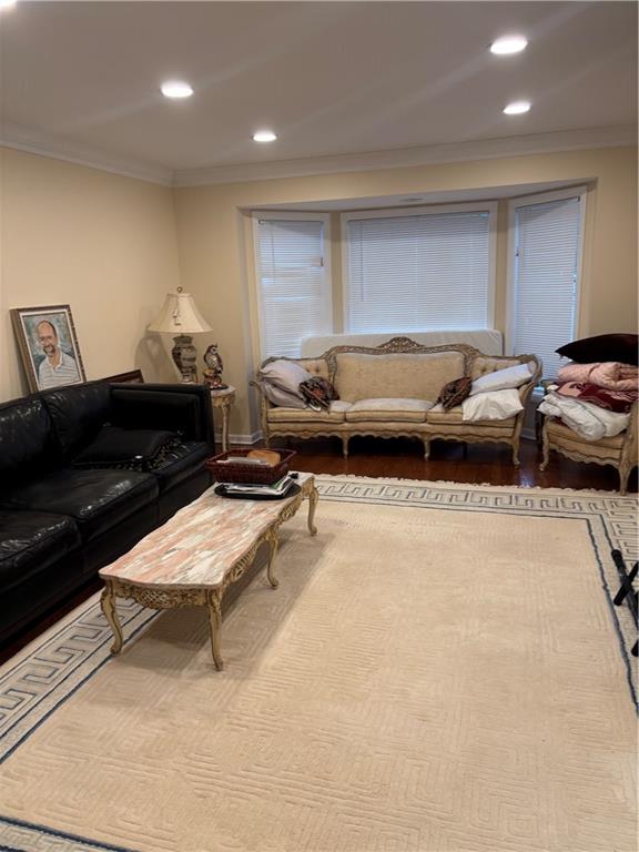 100 Denniston Street, Unit 59 Pittsburgh, PA 15206 - Photo 4 of 24 a living room with furniture a couch and a flat screen tv