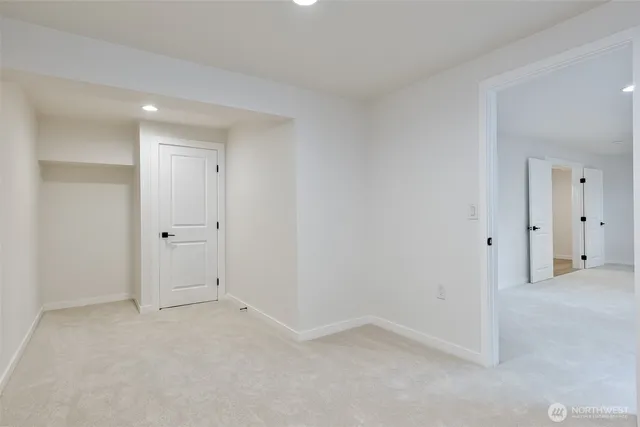 a view of kitchen and empty room