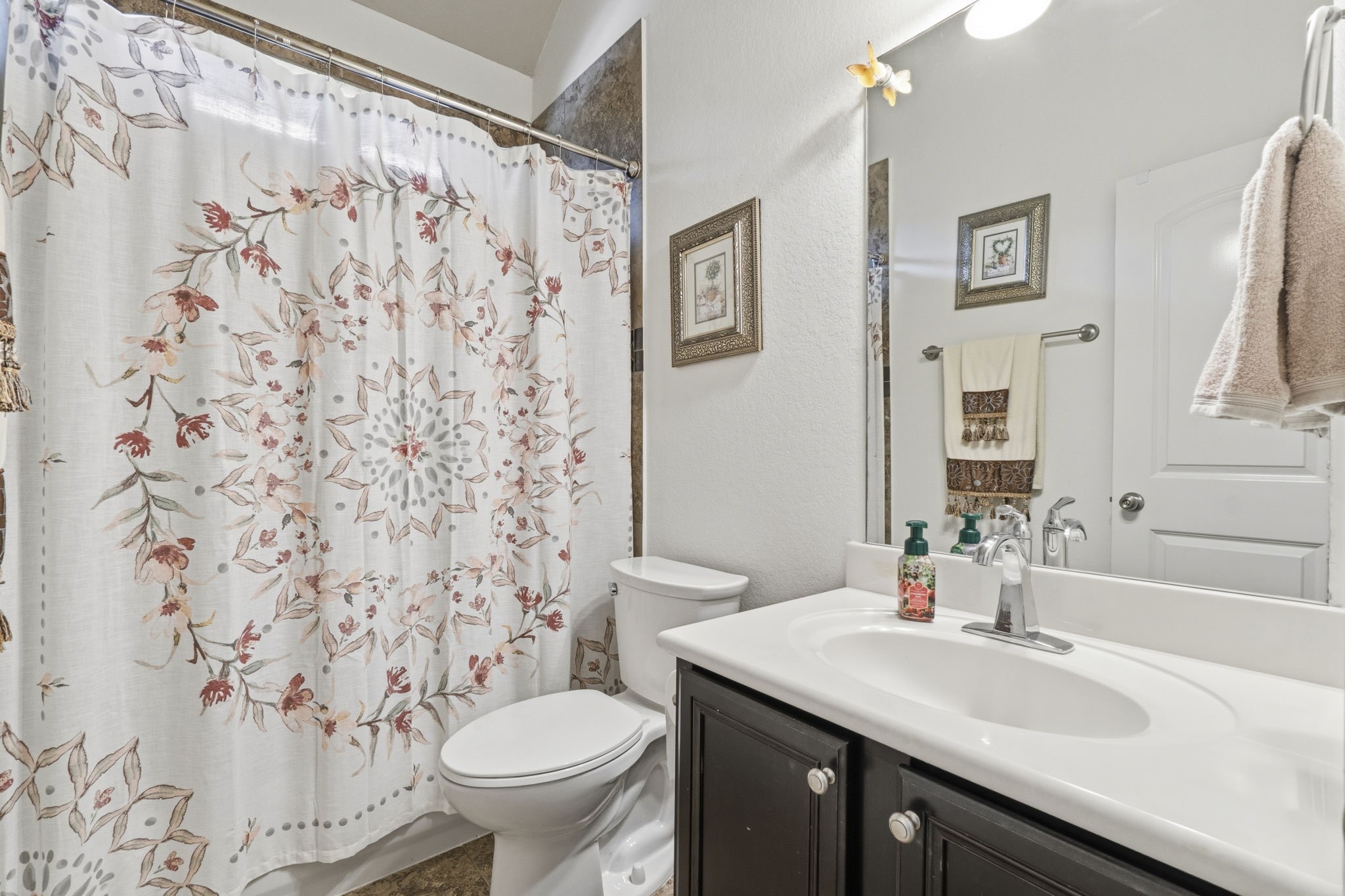 10802 Windswept Montgomery, TX 77356 - Photo 20 of 42 a bathroom with a sink toilet and a mirror