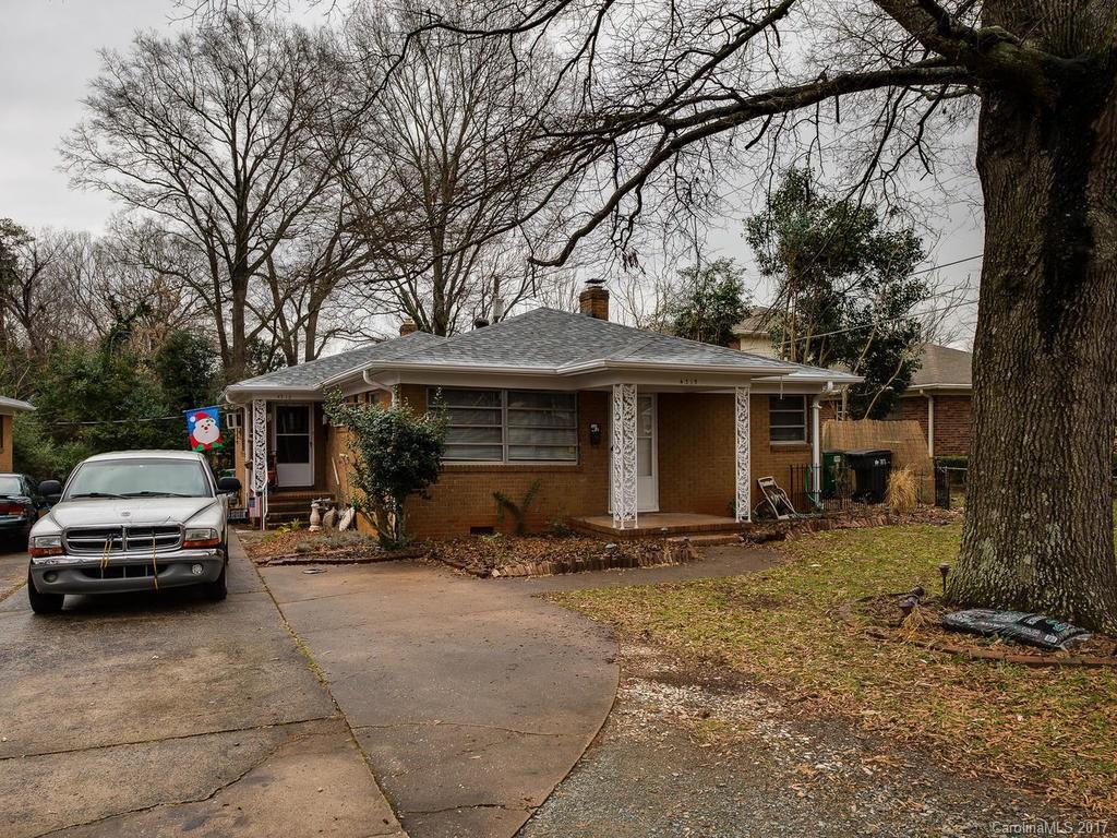 a front view of a house with parking space