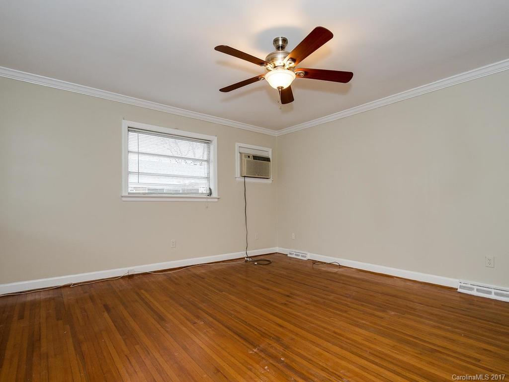 4315 Walker Road Charlotte, NC 28211 - Photo 4 of 14 a view of a big room with wooden floor and windows