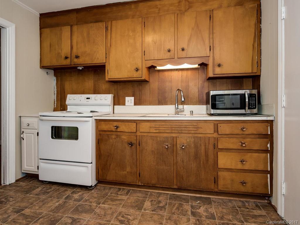 4315 Walker Road Charlotte, NC 28211 - Photo 7 of 14 a kitchen with appliances a sink and cabinets