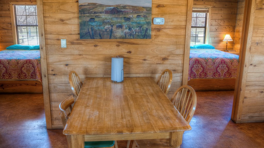 98 Red Wright Road Rio Frio, TX 78879 - Photo 11 of 44 a dining room with couches chairs and wooden floor