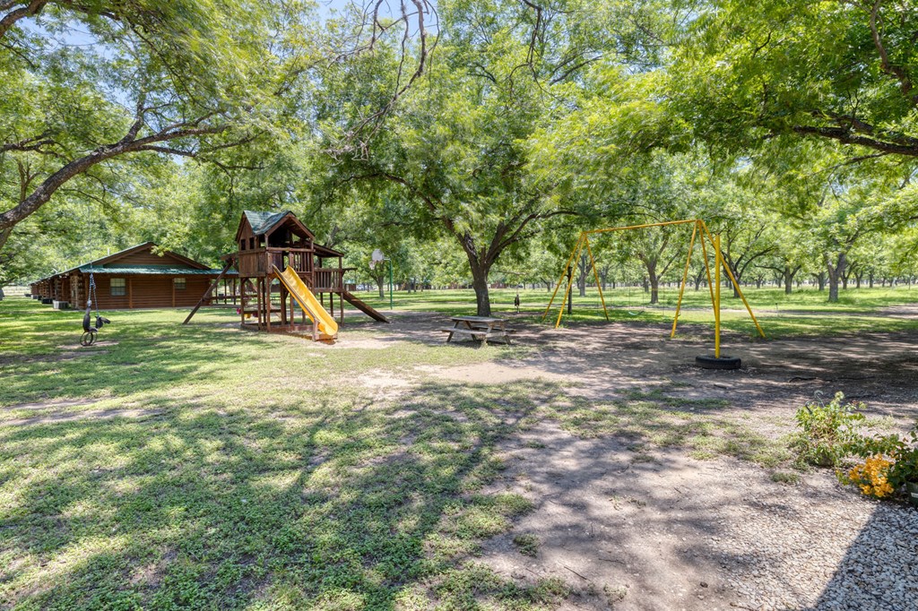 98 Red Wright Road Rio Frio, TX 78879 - Photo 26 of 44 a view of a park with swings and slides