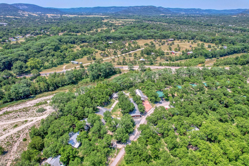 98 Red Wright Road Rio Frio, TX 78879 - Photo 34 of 44 an aerial view of residential house with outdoor space and trees all around