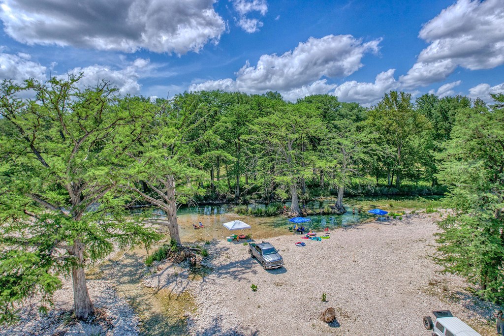 98 Red Wright Road Rio Frio, TX 78879 - Photo 40 of 44 a backyard of a house with table and chairs