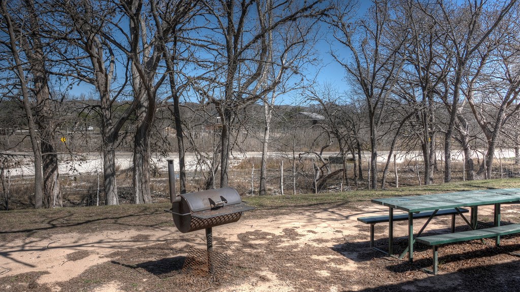 98 Red Wright Road Rio Frio, TX 78879 - Photo 6 of 44 a backyard of a house with lots of green space