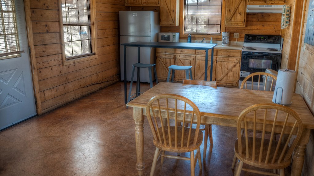 98 Red Wright Road Rio Frio, TX 78879 - Photo 7 of 44 a view of a dining room with furniture and chandelier