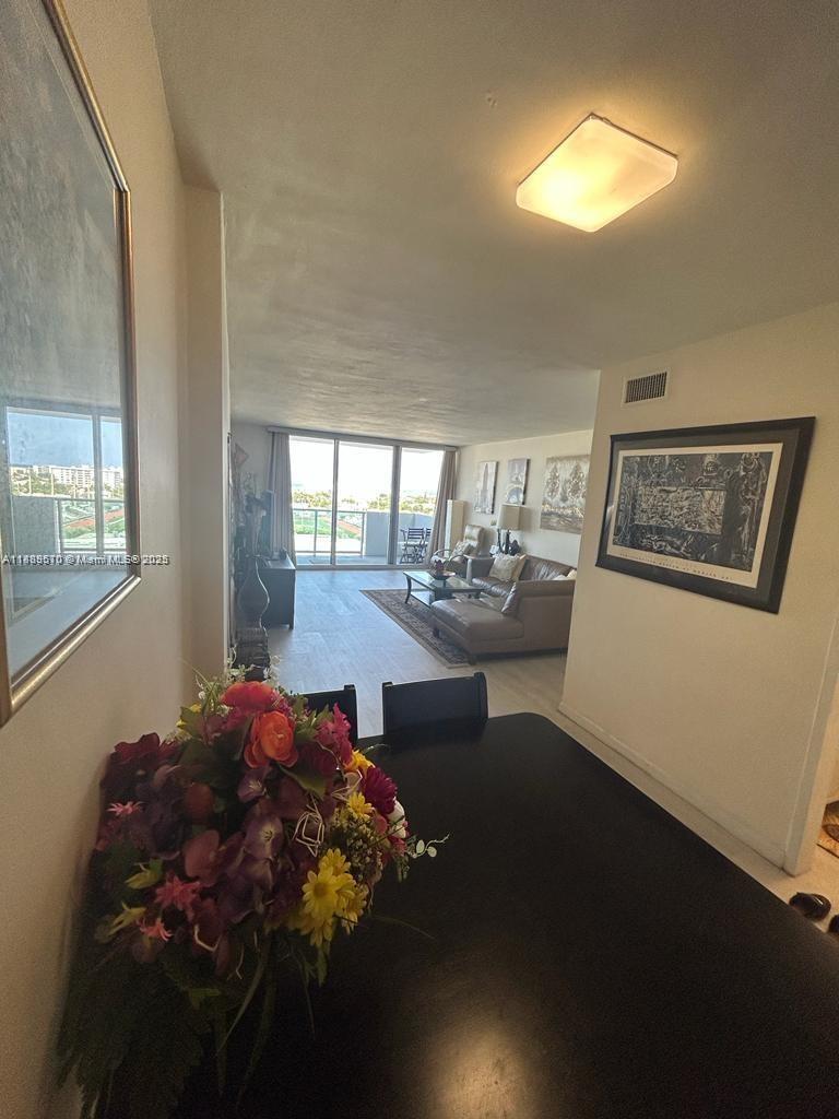 1200 West Avenue, Unit 1008 Miami Beach, FL 33139 - Photo 5 of 17 a bed room with a bed and a chandelier