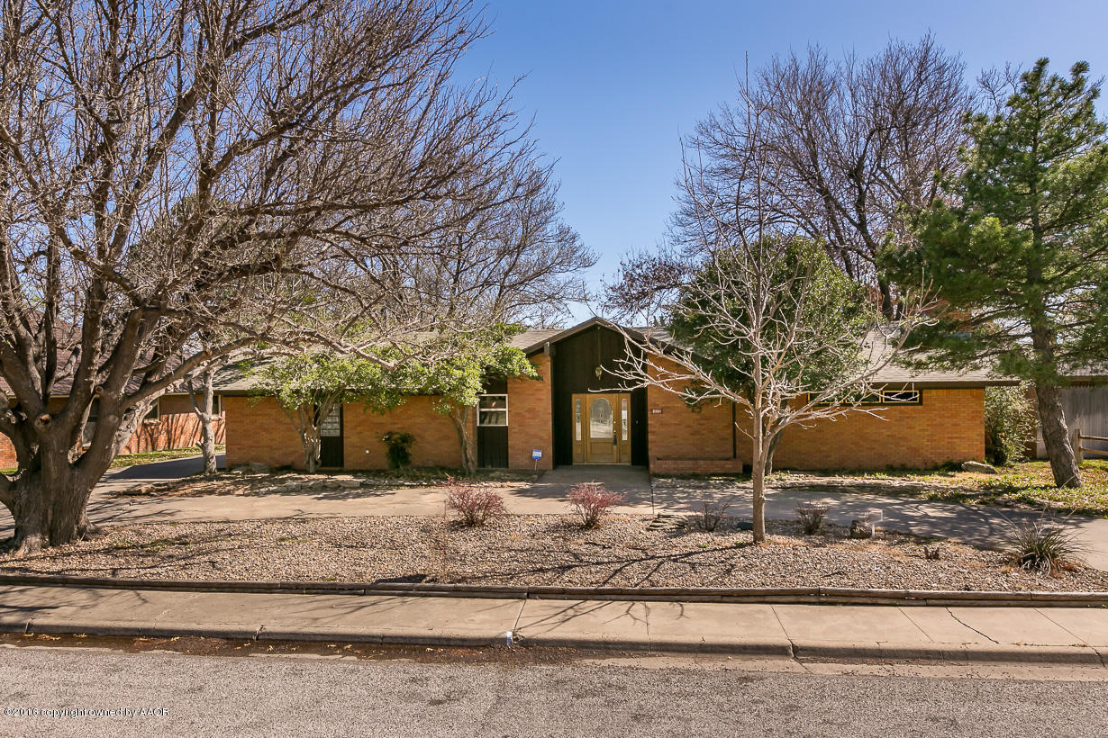 6107 Elmhurst Road Amarillo, TX 79106 - Photo 1 of 32 a front view of a house with a yard