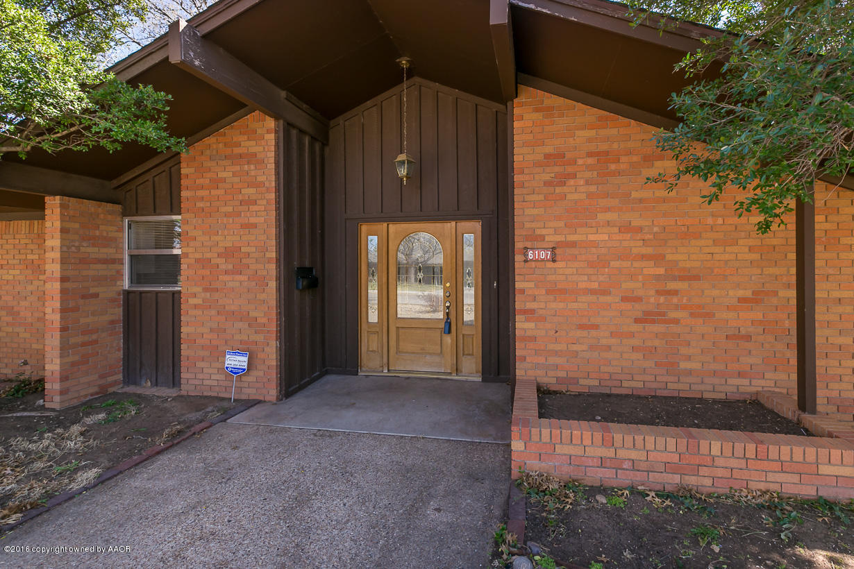 6107 Elmhurst Road Amarillo, TX 79106 - Photo 2 of 32 a view of a front door and wooden floor