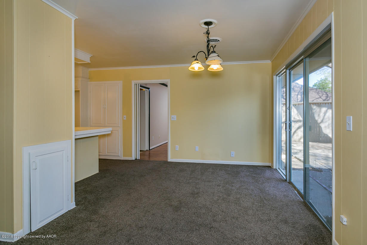 6107 Elmhurst Road Amarillo, TX 79106 - Photo 9 of 32 a view of a livingroom with a chandelier