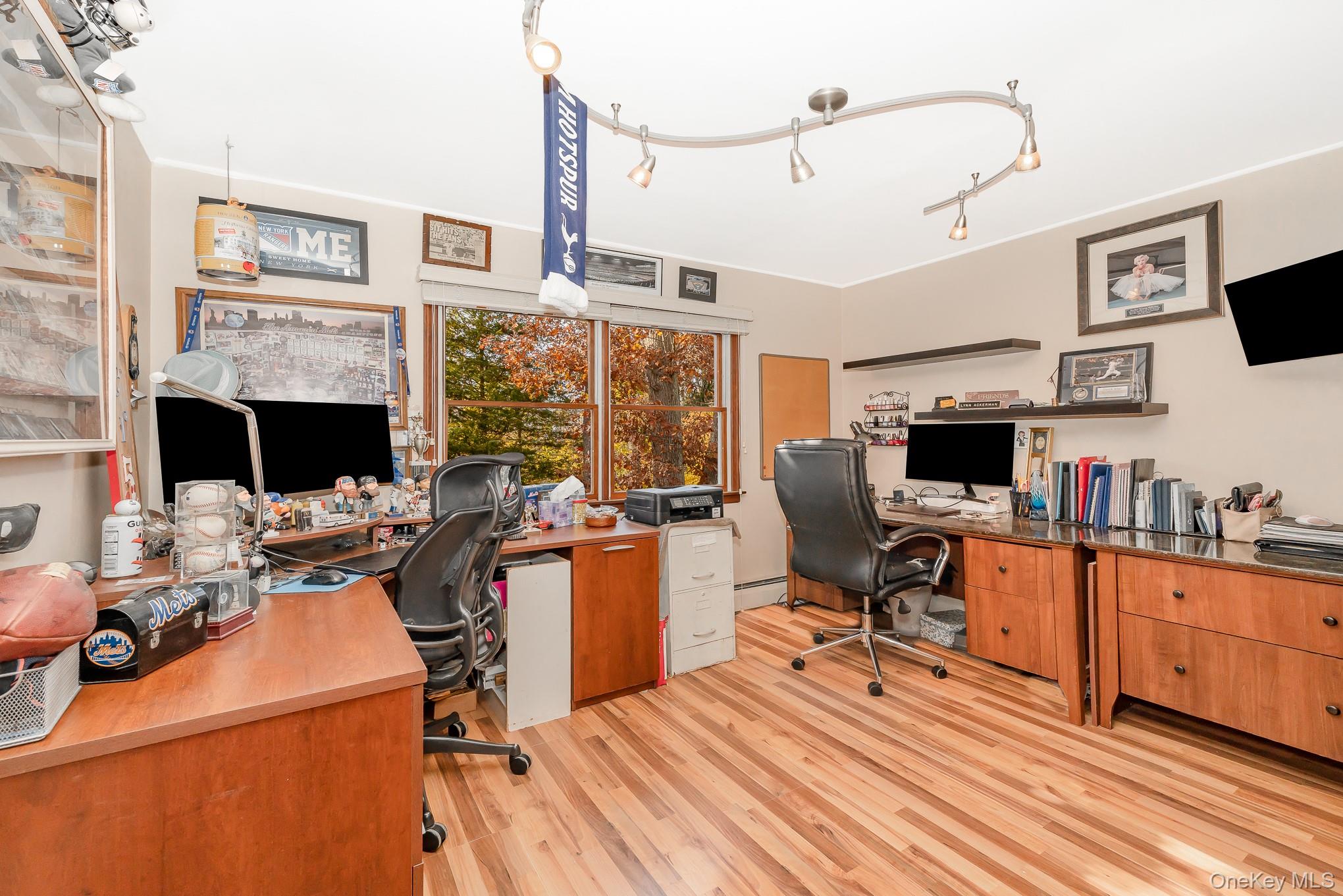 44 Disc Lane Wantagh, NY 11793 - Photo 13 of 26 a view of a workspace with furniture and a fireplace