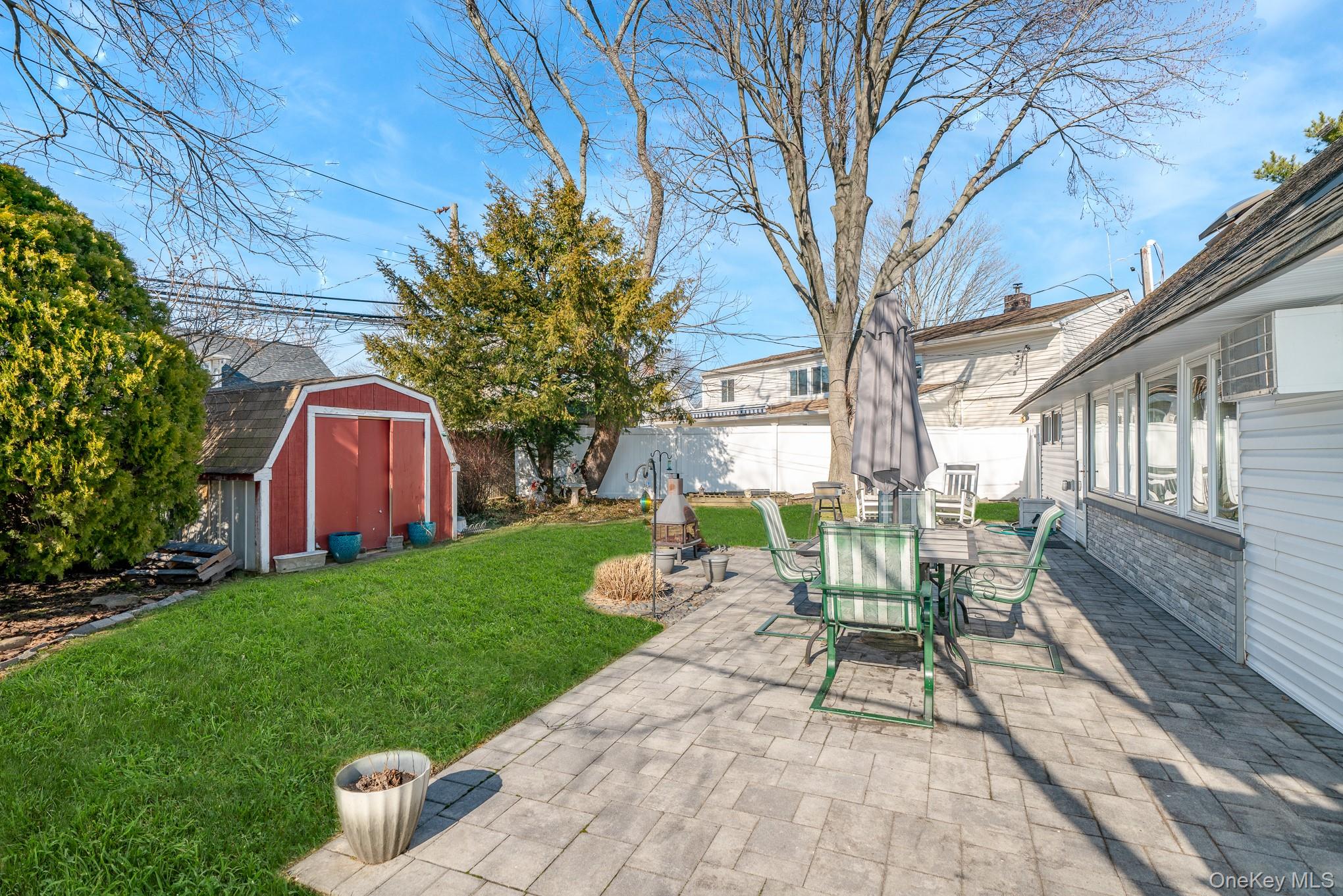 44 Disc Lane Wantagh, NY 11793 - Photo 23 of 26 a view of yard with patio